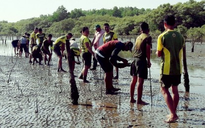<p><strong>PARTNERS.</strong> Members of the Philippine Army take part in a tree-planting activity of a Negros Island regreening initiative in this undated photo. The movement “10 Million in 10 Years for a Greener Negros” achieved its goal in its sixth year this year, four years ahead of schedule, and will not stop planting more to restore the lush forests of the island. <em>(Photo courtesy of 10M in 10 Facebook)</em></p>