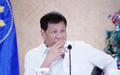 <p><strong>NEUTRAL.</strong> President Rodrigo Roa Duterte talks to the people after holding a meeting with the Inter-Agency Task Force on the Emerging Infectious Diseases (IATF-EID) core members at the Malacañan Palace on Monday (Dec. 13, 2021). He said his Duterte administration will stand “neutral” during the upcoming May 2022 national and elections. <em>(Presidential photo by Simeon Celi)</em></p>