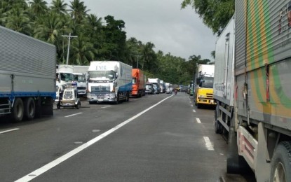 <p><strong>SUSPENDED</strong>. Traffic jam leading to Matnog port in Sorsogon of trucks bound for Samar in this Dec. 13, 2021 photo. The Eastern Visayas Regional Disaster and Risk Reduction Management Council (RDRRMC) has canceled on Tuesday (Dec. 14) land travel of all vehicles bound for Luzon and Mindanao ahead of the storm’s entry in the country to avoid stranding in ports. <em>(Photo courtesy of Philippine Ports Authority)</em></p>