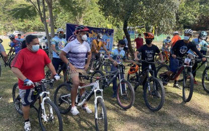 <p><strong>BIKE TOURISM</strong>. Ilocos Norte Governor Matthew Joseph Manotoc (in white shirt) leads a group of bikers as they try one of the newly-launched bike trails at the Karingking Serrek Picnic Grove in Barangay Manalpac, Solsona, Ilocos Norte on Thursday(Dec. 16, 2021). To jumpstart local tourism recovery, at least 12 bike trails in Ilocos Norte are being promoted. <em>(Photo by Leilanie G. Adriano)</em></p>