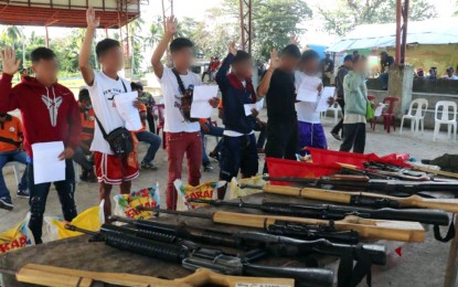 <p><strong>RIGHT PATH.</strong> Ten New People's Army rebels operating in the tri-boundaries of Sultan Kudarat, Sarangani, and South Cotabato provinces pledge allegiance to the government after surrendering to the Army in Palimbang, Sultan Kudarat on Wednesday (Dec. 15, 2021). The surrenderers also turned in nine assorted firearms during their surrender. <em>(Photo courtesy of 37IB))</em></p>