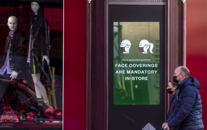 <p><strong>CAUTION.</strong> People walk past a sign requiring people to wear face coverings in London, Britain on Dec. 9, 2021. The World Health Organization's (WHO) Regional Office for Europe on Thursday (Dec. 17, 2021) urged people to exercise caution this holiday season in the wake of highly transmissible coronavirus strains.<em> (Xinhua/Stephen Chung)</em></p>