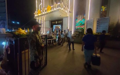 <p><strong>HOLIDAY SECURITY</strong>. A policeman watches over church-goers as part of the intensified police security carried out in Central Luzon in this undated photo. As early as Dec. 16, 2021, about 3,000 police personnel have been put in place to cover all transport terminals, commercial establishments, and places of worship in the region. <em>(Photo by PRO-3)</em></p>