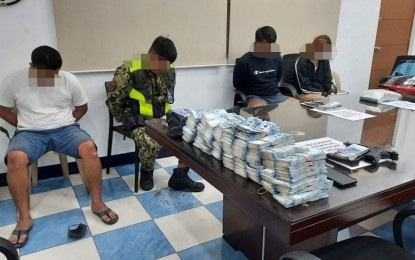 <p><strong>COPS AND ROBBERS.</strong> Four Taguig City cops are arrested for allegedly holding at gunpoint a Japanese and his Filipina partner inside their house in Pasig City and carting away PHP30 million in cash early Saturday morning (Dec. 18, 2021). One civilian was nabbed, two eluded arrest, and one died. <em>(Photo courtesy of NCRPO)</em></p>