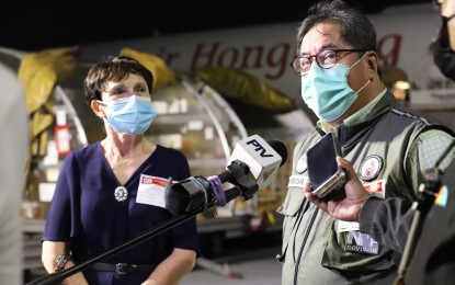 <p><strong>FRANCE DONATION.</strong> National Task Force Against COVID-19 Special Adviser Dr. Teodoro Herbosa (right) speaks to the media during the arrival of 811,980 doses of Pfizer vaccine donated by the French government at Ninoy Aquino International Airport Terminal 3 in Pasay City on Saturday night (Dec.18, 2021). France Ambassador to the Philippines Michèle Boccoz (left) said France hopes to donate 6 million doses of vaccine to the Philippines through COVAX Facility. <em>(PNA photo by Robert Oswald P. Alfiler)</em></p>