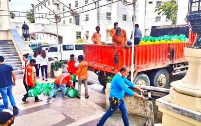 <p><strong>RELIEF OPS.</strong> Workers load food packs, gasoline, and medicines onto a truck at the Cebu Provincial Capitol on Tuesday (Dec. 21, 2021). The truck is headed for Malabuyoc town in southern Cebu, a 5th-class municipality that remains inaccessible to four-wheeled vehicles from Alegria in the north because one lane of a bridge linking it to neighboring Ginatilan had collapsed when Typhoon Odette slammed the province last week. <em>(Contributed photo)</em></p>