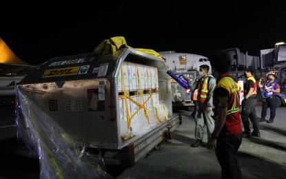 <p><strong>PFIZER BOOSTER FOR TEENS</strong>. An airport personnel uses an electrostatic sprayer to disinfect the newly arrived shipment of Pfizer vaccines at the Ninoy Aquino International Airport Terminal 3 in Pasay City on March 14, 2022. The Department of Health on Saturday (June 25) assured the public there is enough supply of Pfizer vaccine doses, which are being used for additional shots. <em>(PNA file photo)</em></p>