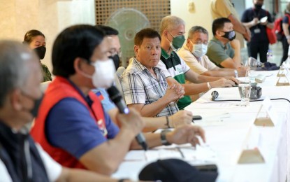 <p><strong>RELIEF EFFORTS</strong>. President Rodrigo Roa Duterte presides over a meeting with local officials of Negros Occidental, uniformed personnel, and officials from the national and local based government agencies to assess the extent of Typhoon Odette's damage as well as discuss the response and relief efforts of concerned government agencies at the Kabankalan City Hall in Kabankalan, Negros Occidental on Dec. 20, 2021. Acting Presidential Spokesperson Karlo Nograles confirmed on Tuesday (Dec.21) that Duterte has committed to raise an additional PHP10 billion for provinces severely affected by “Odette.” <em>(Presidential photo by Arman Baylon)</em></p>