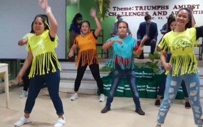 <p><strong>SUMMIT. </strong>Child development welfare workers of San Jose de Buenavista, Antique render a dance number during the Local Social Welfare and Development Provincial Summit at Tuburan sang Kabuhi Bishop's House on Tuesday (Dec. 21 ,2021). Governor Rhodora Cadiao called the social workers "heroes" for carrying out their duties amid the scare of the Covid-19 pandemic and calamities like the recent Typhoon Odette. <em>(PNA photo by Annabel Consuelo J. Petinglay)</em></p>
