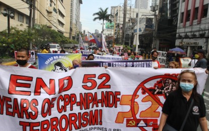 <p><strong>'DON'T RUIN OUR KIDS'</strong>. Members of the League of Parents of the Philippines and the Yakap ng Magulang reiterate their call for the Communist Party of the Philippines - New People's Army -National Democratic Front (CPP-NPA-NDF) to stop the recruitment of minors in a lightning rally in Morayta, Manila on Wednesday (Dec. 22, 2021). They also called for an end to the communist insurgency that has been plaguing the country for more than 50 years. <em>(PNA photo by Avito Dalan)</em></p>