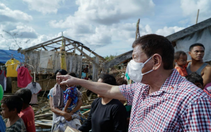 <p><strong>TYPHOON-HIT AREAS VISIT</strong>. President Rodrigo Roa Duterte inspects one of the areas battered by Typhoon Odette in Siargao Island, Surigao del Norte on Dec. 22, 2021. Duterte on Monday (Dec. 27) said he is hoping the New People’s Army will not tinker with the government’s operations to bring back normalcy in areas ravaged by the typhoon. <em>(Presidential photo by King Rodriguez)</em></p>