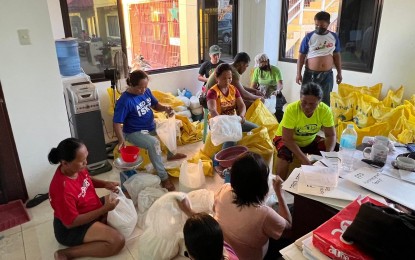 <p><strong>FOOD PACKS.</strong> Volunteers repack relief goods intended for Talibon and Bien Unido towns in Bohol province in this undated photo. The Provincial Capitol on Monday (Dec. 27, 2021) reported that the province has tallied at least 108 individuals who died due to the onslaught of Typhoon Odette on December 16. <em>(Photo courtesy of Gov. Art Yap)</em></p>