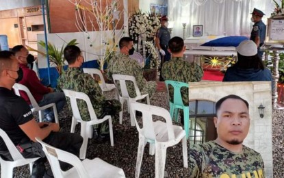 <p><strong>CHRISTMAS MOURNING.</strong> The wake of Cpl. Joebert Diasanta (inset) is being held at the compound of the Silay City Police Station in Negros Occidental. The 36-year-old policeman died in a fire at his parent’s house in neighboring Talisay City on Saturday morning (Dec. 25, 2021). <em>(Photo courtesy of Silay City Police Station-PCR)</em></p>