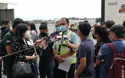 <p><strong>VACCINE ARRIVAL.</strong> Vaccine czar Secretary Carlito Galvez Jr. speaks to the media after the arrival of two million doses of private sector-procured AstraZeneca vaccine at the NAIA Terminal 1 on Tuesday (Dec. 28, 2021). Galvez said the Covid-19 vaccine wastage due to the onslaught of Typhoon Odette remains 'negligible'. <em>(Photo by Raymond Carl Dela Cruz)</em></p>