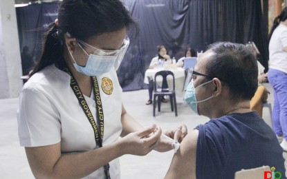 <p><strong>ZERO WASTAGE.</strong> A health worker administers a Covid-19 vaccine in a vaccination site in Cebu City in this undated photo. Cebu City Health Department head, Dr. Jeffrey Ibones, on Wednesday (Dec. 29, 2021) said no single dose of Covid-19 vaccine was wasted or spoiled during the onslaught of Typhoon Odette. <em>(Photo courtesy of Cebu City Hall PIO)</em></p>