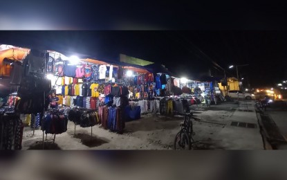 <p><strong>OPTIMISTIC.</strong> A bazaar along Romulo Highway at Mangatarem town in Pangasinan which opened on September 1 this year. Stall owners are optimistic about a brisker business operation now that movement restrictions have been eased. <em>(Photo by Joann Santiago-Villanueva)</em></p>