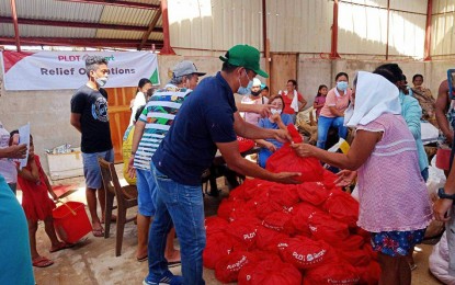 <p><strong>AID TO SIARGAO RESIDENTS</strong>. Food packs are distributed to 1,000 families residing in barangays Malinao and Tawin-tawin in General Luna, Siargao, Surigao del Norte who were affected by Typhoon Odette, on Dec. 29, 2021. As of Thursday (Dec. 30, 2021), a total of 80,921 relief packages has been provided to 53,222 families in Siargao Island who were directly hit by the typhoon. <em>(Photo grabbed from Rep. Bingo Matugas Facebook page)</em></p>
