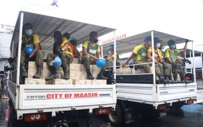 <p><strong>SMC-ARMY TEAM-UP</strong>. Soldiers are onboard trucks loaded with relief goods from San Miguel Corporation on Thursday (Dec. 30, 2021). The giant food firm and the military have worked together to bring these goods to badly affected areas by Typhoon Odette in Southern Leyte. <em>(Photo courtesy of Maasin city government)</em></p>