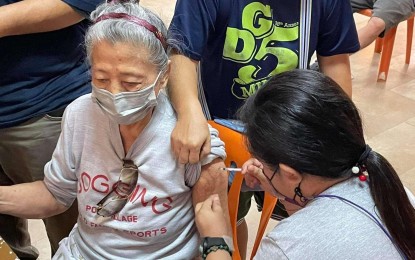 <p><strong>ESSENTIAL SECTOR.</strong> An elderly resident avails of the Covid-19 vaccine in Manila in this December 2021 photo. Vaccination in the capital city will take a break this weekend (January 1-2). <em>(Photo courtesy of Manila-PIO)</em></p>