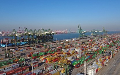 <p><strong>FREE TRADE PACT.</strong> Aerial photo taken on Dec. 18, 2021 shows a view of the Pacific international container terminal at the Tianjin Port of north China's Tianjin Municipality. The Regional Comprehensive Economic Partnership, world's largest free trade pact forged by 15 Asia-Pacific countries, entered into force Saturday to provide a tailwind for the region's post-pandemic recovery and a catalyst for global economic progress, bringing a ray of hope. <em>(Xinhua/Zhao Zishuo)</em></p>
