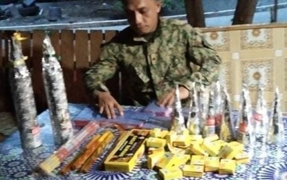 <p><strong>GENERALLY PEACEFUL</strong>. A policeman conducts an inventory of the firecrackers they seized Friday (Dec. 31, 2021), hours before the New Year's Day revelry in Zamboanga City. The city police reported that the celebration was generally peaceful although several residents exploded firecrackers despite a ban on the sale and use of firecrackers and pyrotechnic products. <em>(Photo courtesy of City Hall Public Information Office)</em></p>