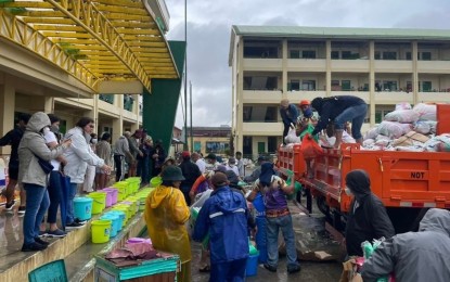 <p><strong>RELIEF DISTRIBUTION.</strong> The team from the Department of Public Works and Highways in Northern Mindanao (DPWH-10) unloads relief packs in Surigao City on Tuesday (Jan. 4, 2022). The packs were donated by different groups and organizations from the Northern Mindanao region. <em>(Photo courtesy of DPWH-10)</em></p>