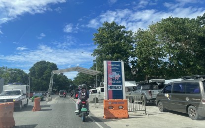 <p><strong>TOURIST TRIAGE SOUTH.</strong> A long queue of vehicles passing through the Tourist Triage South in Pinili, Ilocos Norte on Wednesday (Jan. 5, 2022). After easing travel protocols since the Christmas season, testing is again required for all entrants at the border except for residents who have exited the province for not more than 72 hours. <em>(Photo by Leilanie G. Adriano)</em></p>