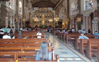 <p><strong>FAITH IN STO. NIÑO.</strong> Roman Catholic faithful visit the old Basilica Minore del Sto. Niño de Cebu church to offer prayers, in this file photo. Cebuanos put their unwavering faith in the Sto. Niño to withstand the trials brought by the twin calamities – the Covid-19 pandemic and Typhoon Odette. <em>(PNA photo by John Rey Saavedra)</em></p>