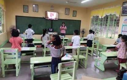 <p><strong>FACE-TO-FACE LEARNING</strong>. Learners at the Dumalneg Elementary School in Dumalneg town, Ilocos Norte practice minimum health and safety protocols as they attend limited in-person classes in this file photo. The face-to-face classes now are in full swing with around 1.26 million learners enrolled. <em>(Photo courtesy of DepEd Tayo Ilocos Norte)</em></p>