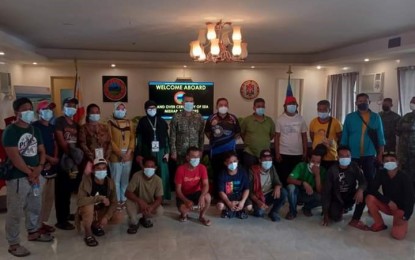 <p><strong>RESCUED FILIPINOS.</strong> Malaysian authorities turn over to Philippine authorities 15 Filipinos rescued in Sabah during a turnover ceremony at the maritime border of the Philippines and Malaysia on Monday (Jan. 10, 202). The Filipinos were traveling to the Turtle Islands town in Tawi-Tawi coming from Bongao, the province's capital when the vessel they were on board drifted to Sabah after its engine conked out. <em>(Photo courtesy of the Naval Forces Western Mindanao)</em></p>