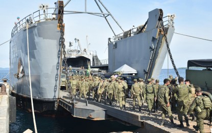 <p><strong>NEW ASSIGNMENT.</strong> Troops of the Army's 68th Infantry Battalion (IB) board a Philippine Navy ship Tuesday (Jan. 11, 2022) at the port of Lamitan City, Basilan en route to Mindoro, their new place of assignment as the Armed Forces of the Philippines reshuffled some of its forces in the country. The 68IB troops, who served in Basilan from Sept. 6, 2016, will be replaced by the Army's 14th Division Reconnaissance Company and 17th Scout Ranger Company. <em>(Photo courtesy of Westmincom)</em></p>