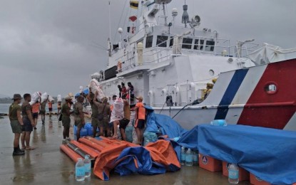 <p><strong>SHIPPING RELIEF.</strong> The Philippine Coast Guard (PCG) and the Philippine Army (PA) during a joint relief transport mission aboard BRP Bagacay (MRRV-4410) to Halian and Caub Islands in Surigao del Norte on Friday (Jan. 14, 2022). To date, the PCG and the PCG Auxiliary have transported over 2,000 tons of relief goods to areas in need following the onslaught of Typhoon Odette. <em>(Photo courtesy of PCG)</em></p>