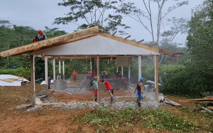 <p><strong>DEMOLITION.</strong> Indigenous people (IP) residents of Purok 6, Sitio Cambudlot, Barangay San Miguel, Compostela, Davao de Oro lead the demolition of the Salugpongan Ta' Tanu Igkanogon Community Learning Center on Friday (Jan. 14, 2022). The demolition came after the IP community filed a resolution in April last year requesting a Department of Education-run school in their area, expressing concern that the Salugpongan might be teaching its students to revolt against the government. <em>(PNA photo by Che Palicte)</em></p>