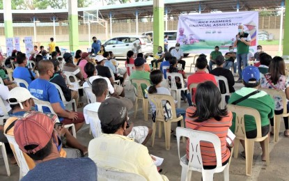 <p><strong>HELP FOR FARMERS</strong>. Negros Occidental Governor Eugenio Jose Lacson speaks before farmers in Moises Padilla town, who are recipients of the Rice Farmers Financial Assistance from the Rice Competitiveness Enhancement Fund of the Department of Agriculture at the municipal covered court on Monday (Jan. 17, 2022). Some 1,054 farmers received P5,000 each. <em>(Photo courtesy of PIO-Negros Occidental)</em></p>