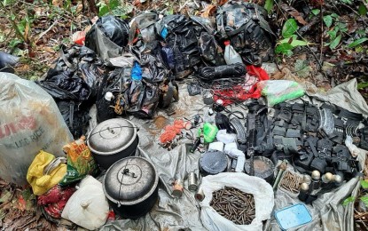 <p><strong>SEIZED.</strong> The anti-personnel mines, high-powered firearm and ammunition seized by the military after an armed encounter in Barangay Motorpool, Tubod, Surigao del Norte last Jan. 16, 2022. The encounter broke out after the troopers responded to a report from civilians on the presence of NPA rebels in the area.<em> (Photo courtesy of 30IB)</em></p>