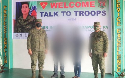 <p><strong>PATH TO PEACE</strong>. Brig. Gen. Inocencio Pasaporte (left), commander of the Army’s 303rd Infantry Brigade, and Lt. Col. J-jay Javines (right), commanding officer of 79th Infantry Battalion, with former Communist Party of the Philippines-New People’s Army rebels alias “Bruno”, 30, and alias “Mary”, 29, during a ceremony held at the battalion headquarters in Barangay Bato, Sagay City, Negros Occidental on Jan. 17, 2022. The two surrenderers, who turned themselves in on January 15, were cadres of the dismantled Northern Negros Front, Komiteng Rehiyon-Negros Cebu Bohol Siquijor. <em>(Photo courtesy of 79th Infantry Battalion, Philippine Army)</em></p>