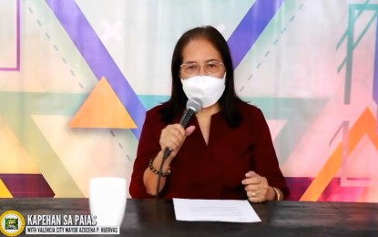 <p><strong>PUBLIC ADDRESS.</strong> Valencia City Mayor Azucena P. Huervas of Bukidnon province gives an update on the local government initiatives and programs especially in the coronavirus disease 2019 (Covid-19) response in a Facebook live stream program on Friday (Jan. 21, 2022). The mayor said the increase of Covid-19 cases in the city was unrelated to the celebration of the city’s 21st charter day on January 12, as the observation was simple and had adhered to strict health protocols.<em> (Screengrab via Valencia CIO)</em></p>