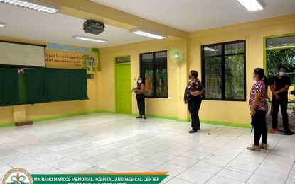 <p><strong>SCHOOL-TURNED-FIELD HOSPITAL</strong>. Health and education officials in Batac City inspect the Catalino Acosta Memorial Elementary School in this undated photo for the conversion of its rooms into a temporary field hospital of the Mariano Marcos Memorial Hospital and Medical Center. If the surge of Covid-19 cases continues, some of the regular patients of the hospital will be transferred to this facility, a hospital official said Friday (Jan. 21, 2022).<em> (Photo courtesy of the MMMH&MC)</em></p>