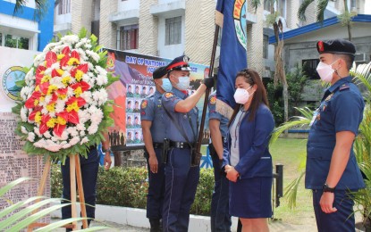 <p><strong>HEROISM</strong>. Liezel Inocencio (center), widow of Special Action Force (SAF) 44 SPO1 Lover Inocencio, joins the Police Regional Office in Davao Region (PRO-11) in the commemoration of the heroism of the 44 SAF troopers on Tuesday (January 25, 2022). The 44 SAF commandos died in a botched police operation called "Oplan Exodus” against two high-value targets, Malaysian terrorist Zulkifli bin Hir, alias Marwan, and terrorist Abdul Basit Usman on Jan. 25, 2015, in Mamasapano, Maguindanao. <em>(Photo courtesy of PRO-11)</em></p>