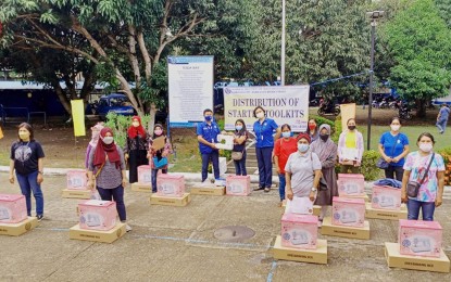 <p><strong>FREE TRAINING.</strong> Fifty scholars of the Dressmaking National Certificate II course of the Technical Education and Skills Development Authority receive their starter tool kits under the Universal Access to Quality Tertiary Education Act in Zamboanga City on Jan. 14, 2022. The agency also offers online programs that can be completed at the students’ own pace. <em>(Photo courtesy of TESDA)</em></p>