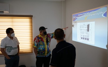 <p><strong>PROJECT DISCUSSION</strong>. Pampanga Governor Dennis Pineda (center) and Apalit Mayor Jun Tetangco (left) discuss the plan for the soon-to-rise district hospital in the town along with Engineer Alfie Lejarde (right), maintenance section chief of the Department of Public Works and Highways-First District Engineering Office. This will be the 11th district hospital in Pampanga. <em>(Photo courtesy of the Provincial Government of Pampanga)</em></p>