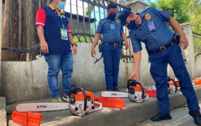 <p><strong>CONFISCATED CHAINSAWS.</strong> Personnel of the Department of Environment and Natural Resources - Soccsksargen and the local police seize three unregistered chainsaws being sold on Judge Alba Street in Koronadal City on Thursday (Jan. 27, 2022). The agency intensified its campaign against unregistered chainsaws following the order of Environment Secretary Roy Cimatu to prevent the illegal cutting of trees in forest areas. <em>(Photo courtesy of DENR-12)</em></p>