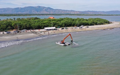 <p><strong>DREDGING OPERATIONS.</strong> The amphibious excavator of the Department of Public Works and Highways-Ilocos Region arrives in Lingayen, Pangasinan on Friday (Jan. 28, 2022). The equipment will dredge silt and soil from river tributaries, starting at the mouth of Limahong Channel.<em> (Photo courtesy of Municipal Information Office of Lingayen)</em></p>