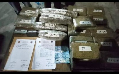 <p><strong>EVIDENCE.</strong> Twenty bricks of dried marijuana leaves with a street value of PHP2.8 million, mobile phones, and bust-buy money were seized in an anti-illegal drug operation in Barangay Panasahan, Malolos City, Bulacan on Saturday night (Jan. 29, 2022). Another buy-bust operation in the City of San Jose Del Monte yielded 50 grams of shabu with an estimated worth of PHP400,000. <em>(Photo courtesy of Malolos City PNP)</em></p>