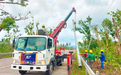 <p><strong>POWER RESTORATION.</strong> Linemen work to restore electricity in Sogod, Southern Leyte in this Jan. 29, 2021 photo.  Power has been restored in 110 out of 500 villages in Southern Leyte after more than a month of outage due to the destruction wreaked by Typhoon Odette.<em> (Photo courtesy of Southern Leyte Electric Cooperative)</em></p>