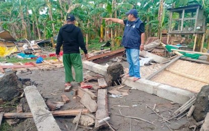 <p><strong>FLATTENED HOUSES.</strong> Mindato Malasigan (right), disaster officer of Mother Kabuntalan, Maguindanao, inspects the houses destroyed by a tornado that hit seven villages and displaced some 100 persons on Monday (Jan. 31, 2022). At least 100 individuals and 30 homes were damaged in the incident <em>(Photo courtesy of Kabuntalan Mother LGU)</em></p>