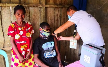 <p><strong>PROTECTED</strong>. A Mamanwa tribe member receives the single-dose Janssen vaccine in Caucab village in Almeria, Biliran during a vaccination drive in their community on Feb. 2, 2022. Some 24 members of the Mamanwa tribe in Almeria, Biliran are now fully-vaccinated against Covid-19 amid hesitancy and distance of their settlement from health facilities. <em>(Photo courtesy of Brett Abrea)</em></p>