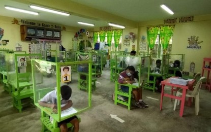 <p><strong>BACK TO THE CLASSROOM.</strong> Learners of the Laserna Integrated School in Nabas, Aklan during their limited face-to-face class on Dec. 3, 2021. A total of 80 schools in Western Visayas stand ready to implement the expanded limited face-to-face classes once the region is de-escalated to Alert Level 1 or 2, the head of the regional education office, Ramir Uytico, said on Friday (Dec. 4, 2022).<em> (Photo courtesy of Laserna Integrated School FB page)</em></p>