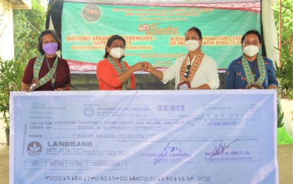 <p><strong>AGRI-FISHERY BUILDING.</strong> Dr. Marila L. Corpuz, Department of Agriculture in Davao Region (DA-11) technical director for operations (2nd from left), fist bumps with Dr. Ruth Lucero, president of the Southern Philippines Agri-Business and Marine and Aquatic School of Technology (SPAMAST) as the DA-11 turns over PHP40 million worth of interventions to the school on Thursday (Feb. 3, 2022) in Malita, Davao Occidental. The project aims to provide the smallholder farmers and fisherfolk with access to resources, including state-of-the-art production technology, capital, and value-adding facilities. <em>(Photo courtesy of DA-11)</em></p>