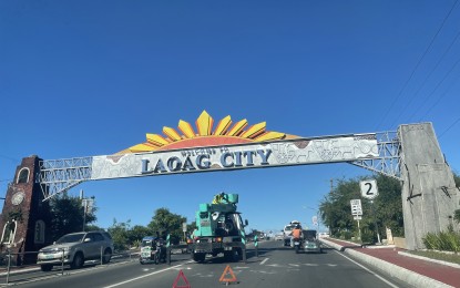 <p><strong>PREPARATION.</strong> A worker on a boom lift fixes the new welcome arc of Laoag City, Ilocos Norte, along the Gilbert Bridge, in this undated photo. Laoag is preparing for the Pamulinawen Festival on Thursday (Feb. 10, 2022), a non-working holiday in the city. <em>(PNA photo by Leilanie G. Adriano)</em></p>